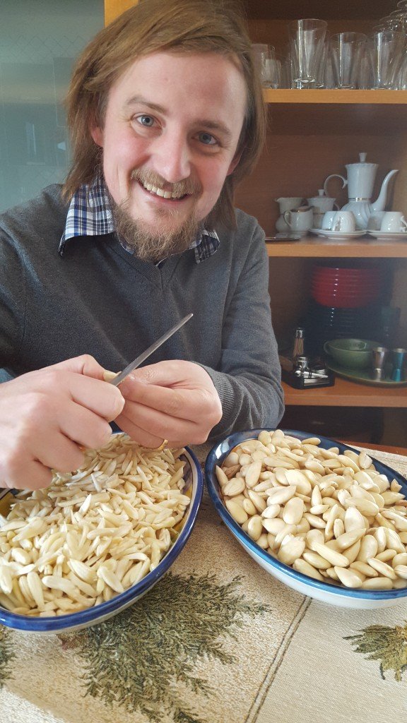 George happily chopping almonds.