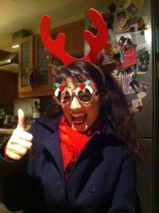 Mariacristina wearing ridiculous Christmas glasses and a thumb up