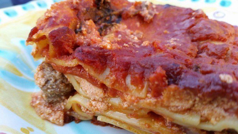 Slice of neapolitan lasagne served on a plate