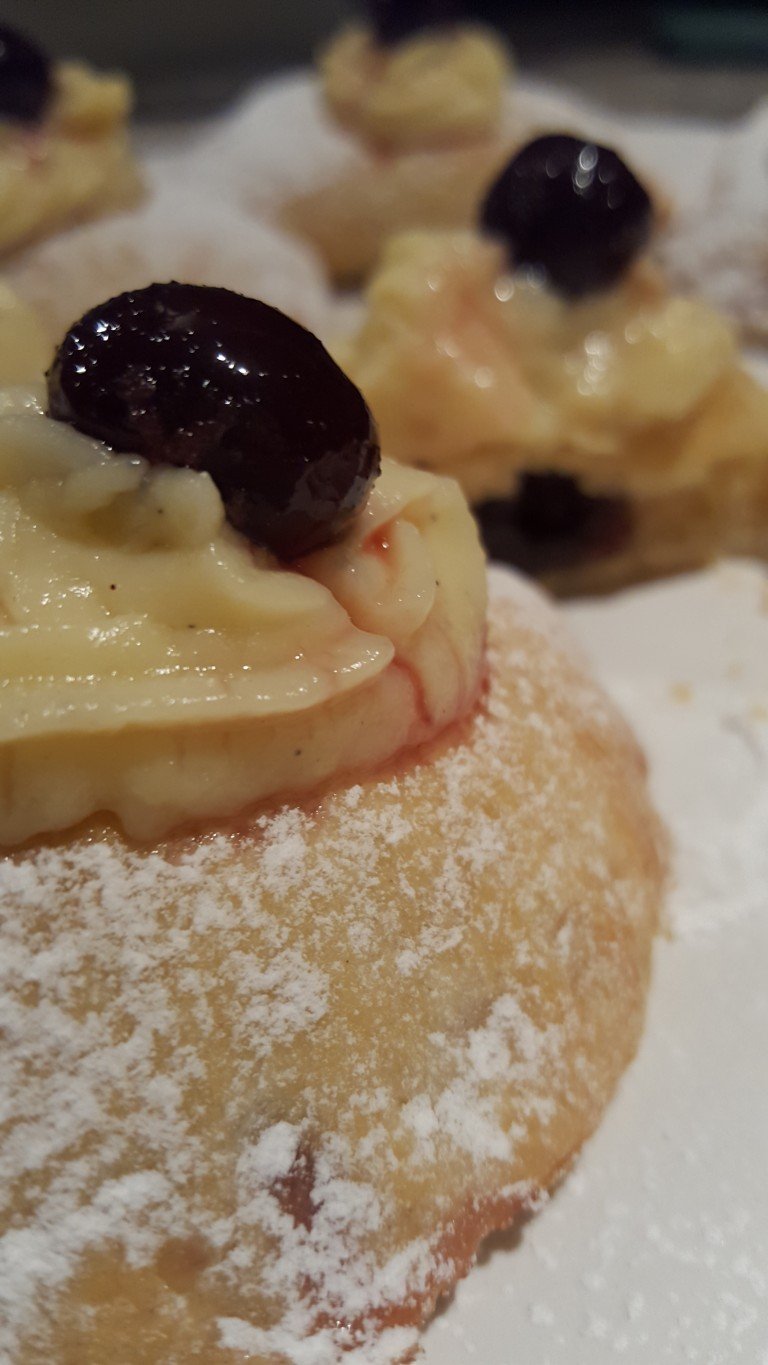 Monachine covered with custard and morello cherries