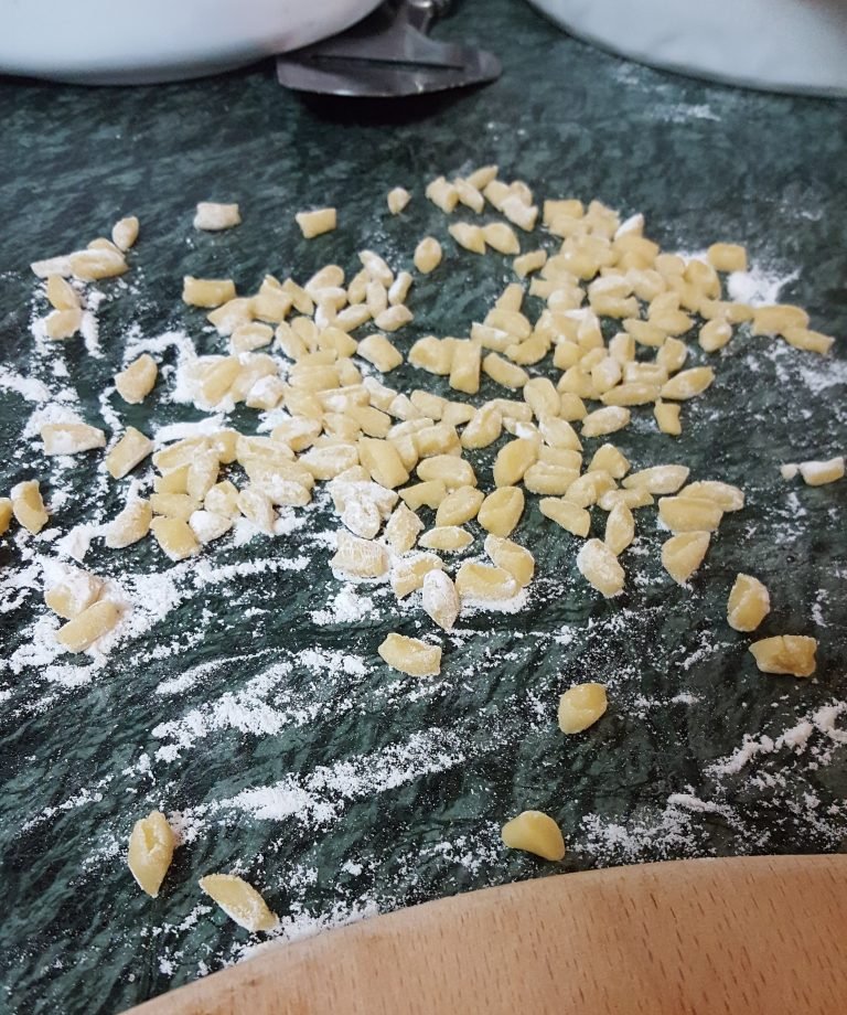 Bits of dough cut off from the dough of struffoli
