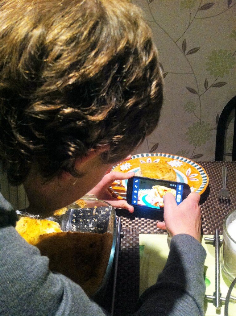 George taking pictures of food