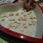 Home made potato gnocchi laid on a heart shaped tray